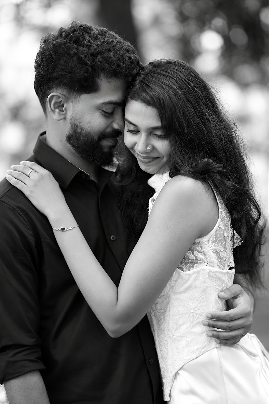 Aiswarya and Abhijith, forehead to forehead in a quiet embrace